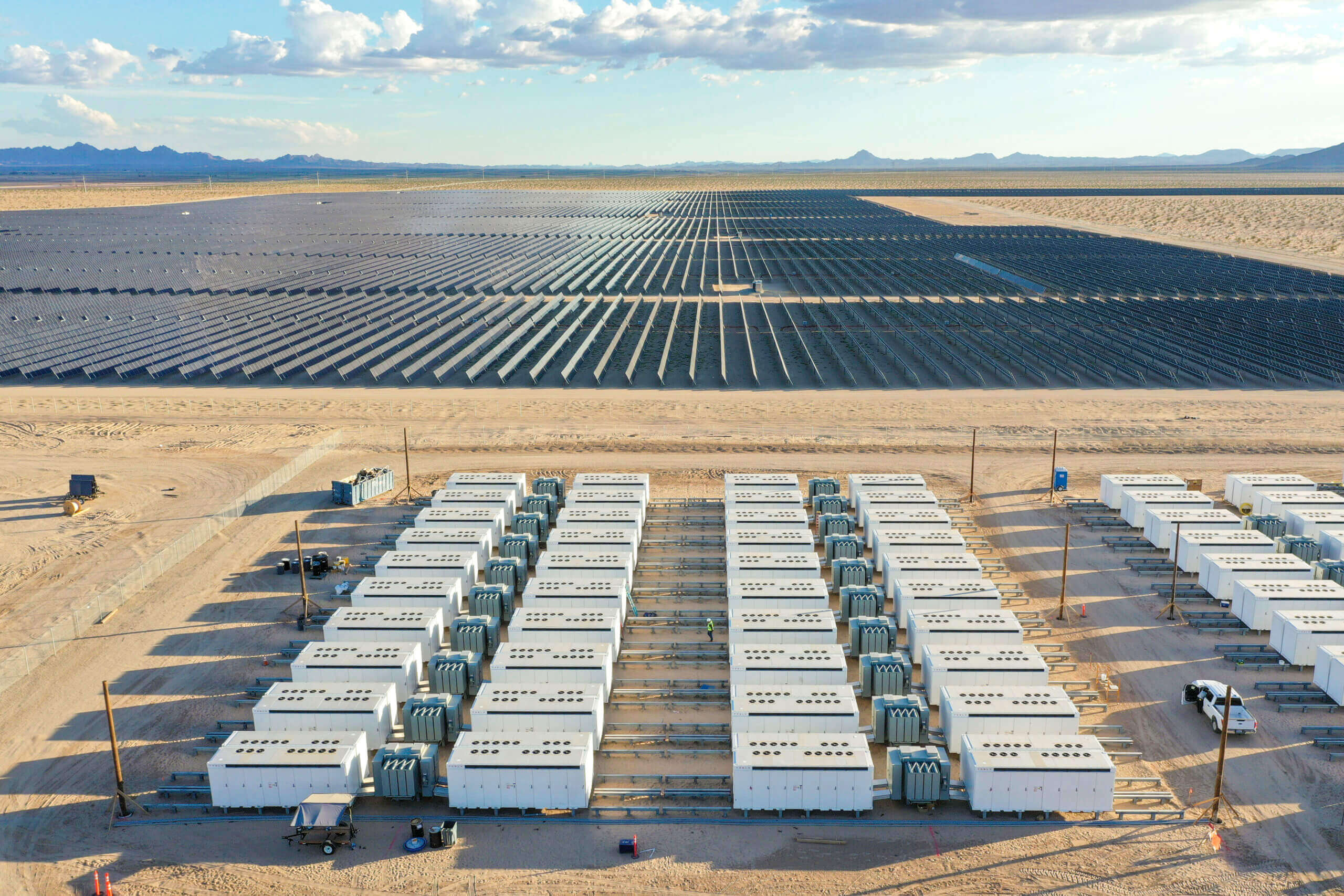 Workers gathered around solar panel 'table'